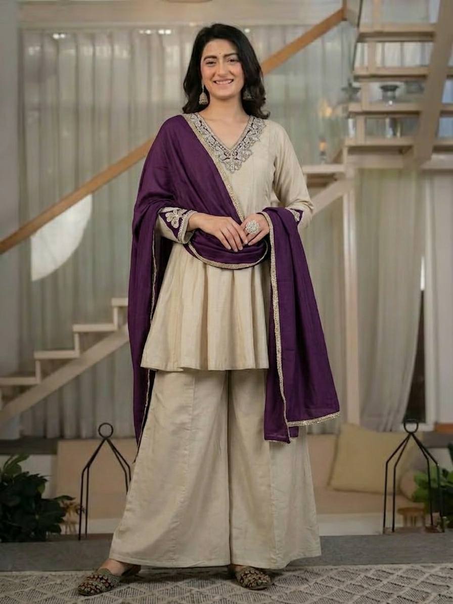 Regal Cream Silk Peplum Kurti and Flared Palazzo Suit Set Adorned with Ornate V-Neck Embroidery and a Rich Plum Purple Dupatta